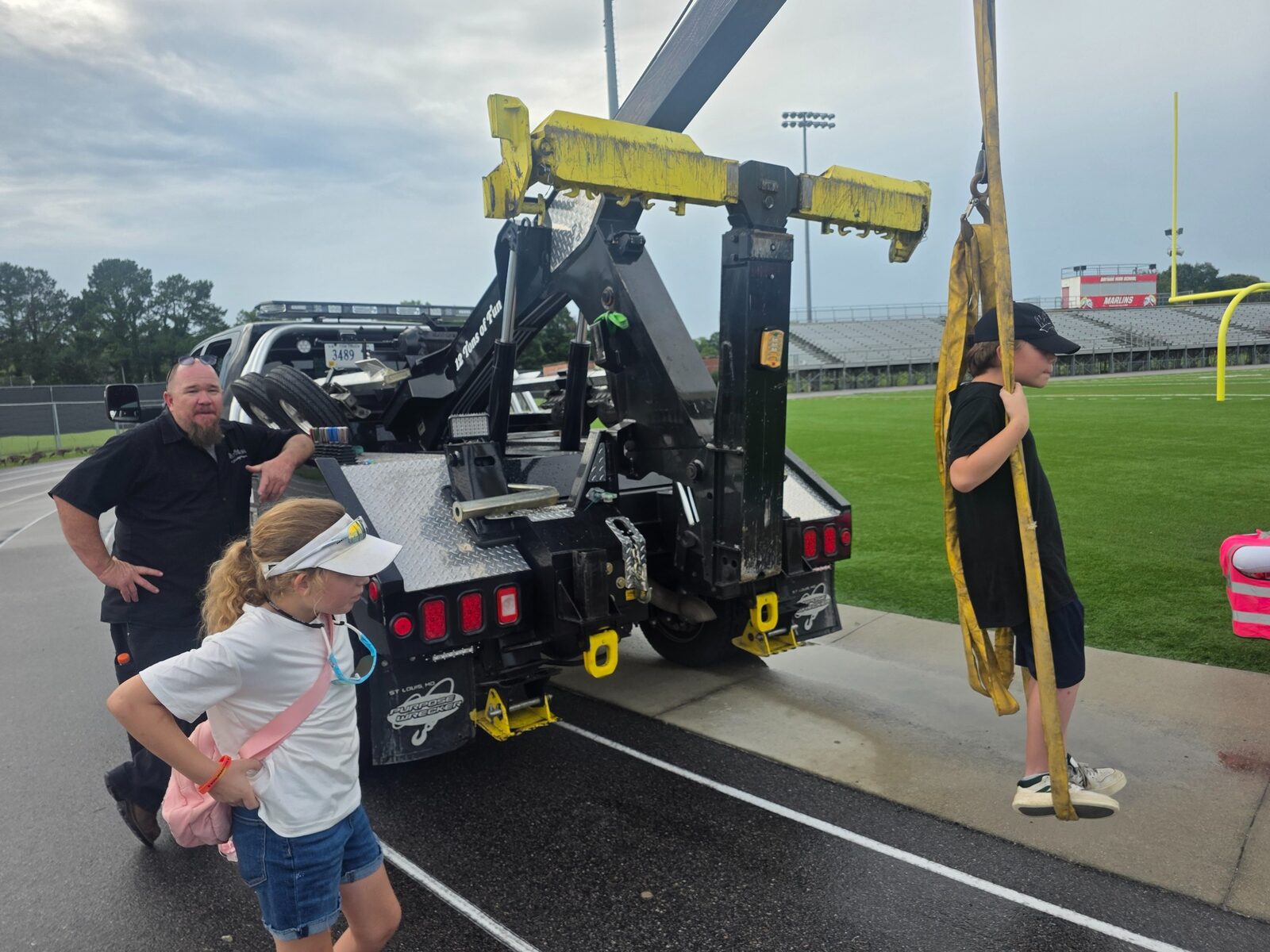 Families explore the Bridger Towing recovery truck