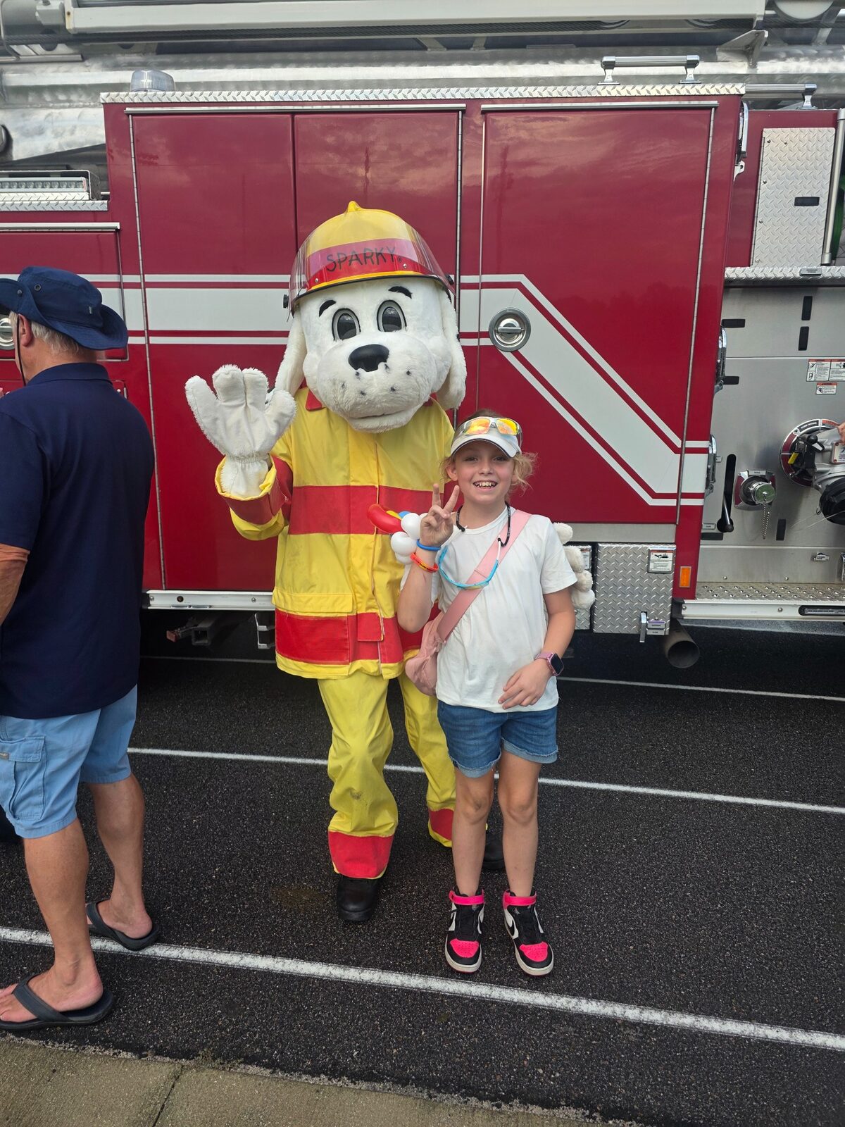 Sparky greets a young National Night Out guest