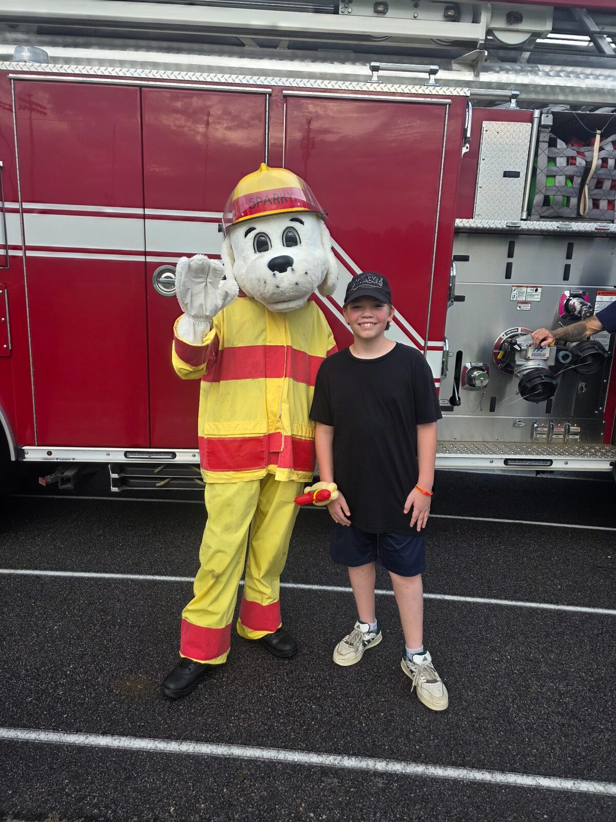 Sparky and a young community guest