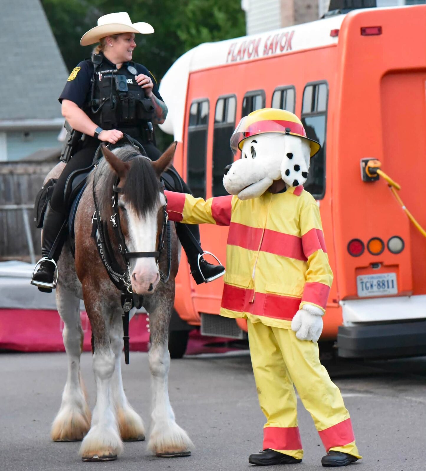 Mounted police and Sparky greet families